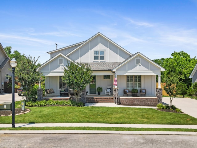 3528 Morning Dew Cv, Apison, TN 37302 - view of front of property with covered porch, board and batten siding, and a front yard