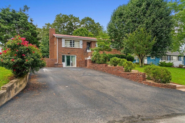 1339 Cloverdale Cir, Hixson, TN 37343 - view of front of property with a chimney, brick siding, and driveway