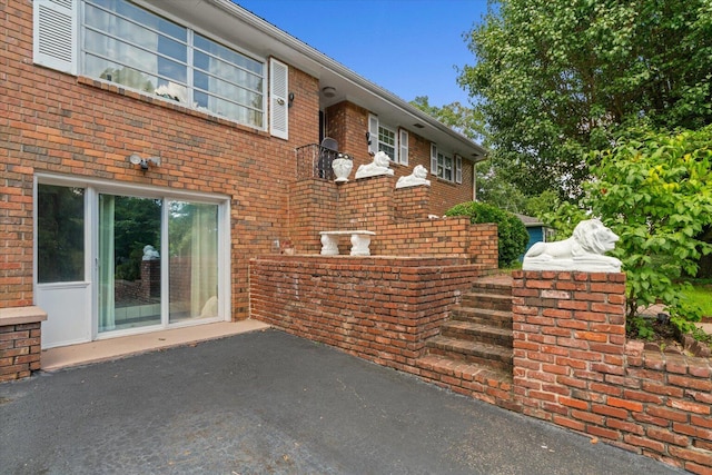 1339 Cloverdale Cir, Hixson, TN 37343 - view of side of home with brick siding and a patio