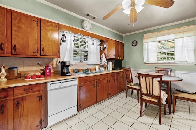1339 Cloverdale Cir, Hixson, TN 37343 - kitchen featuring dishwasher, crown molding, brown cabinetry, light countertops, and backsplash