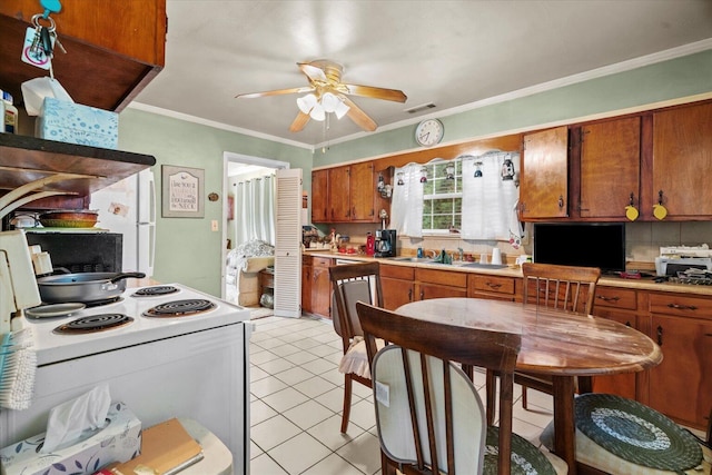 1339 Cloverdale Cir, Hixson, TN 37343 - kitchen featuring brown cabinets, a ceiling fan, white appliances, light countertops, and ornamental molding