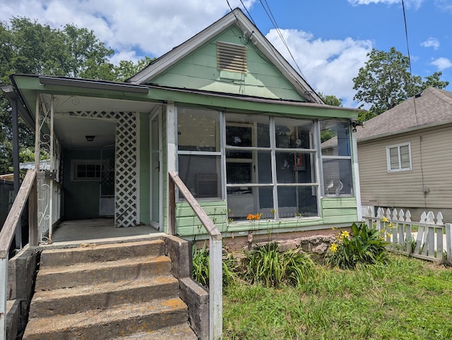 2307 E 35th St, Chattanooga, TN 37407 - shotgun-style home with a sunroom
