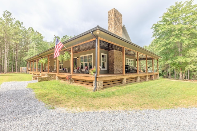 508 Chattanooga Rd, Cohutta, GA 30710 - back of property featuring a chimney, a lawn, and a deck