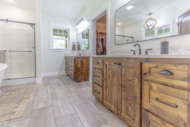 508 Chattanooga Rd, Cohutta, GA 30710 - bathroom with a stall shower, vanity, a walk in closet, a chandelier, and recessed lighting