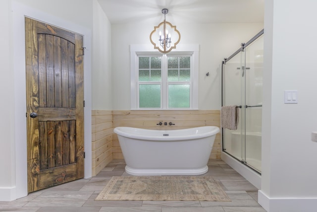 508 Chattanooga Rd, Cohutta, GA 30710 - full bathroom with a soaking tub, a stall shower, a chandelier, and a wainscoted wall