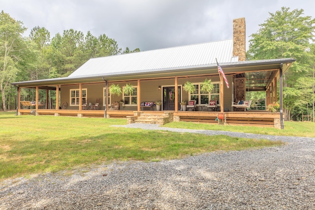 508 Chattanooga Rd, Cohutta, GA 30710 - rear view of property featuring a chimney, covered porch, a yard, and a metal roof