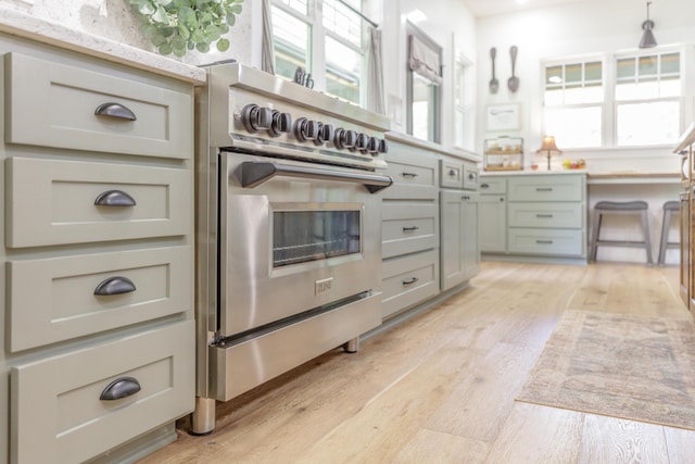508 Chattanooga Rd, Cohutta, GA 30710 - kitchen featuring high end stove, light wood-type flooring, and light countertops