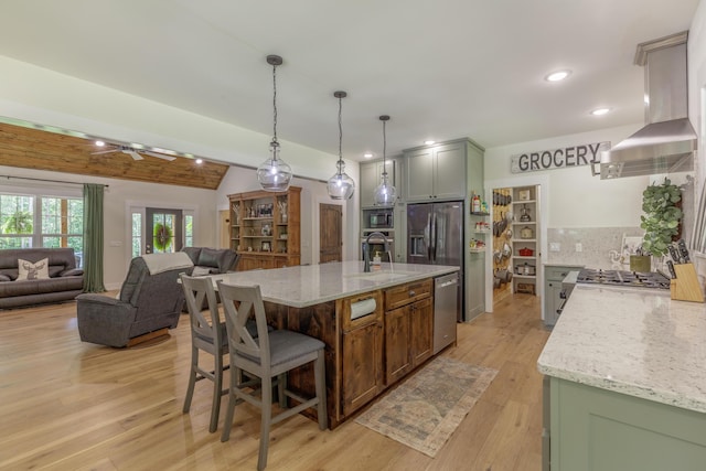 508 Chattanooga Rd, Cohutta, GA 30710 - kitchen with extractor fan, stainless steel appliances, light wood-style flooring, tasteful backsplash, and light stone countertops