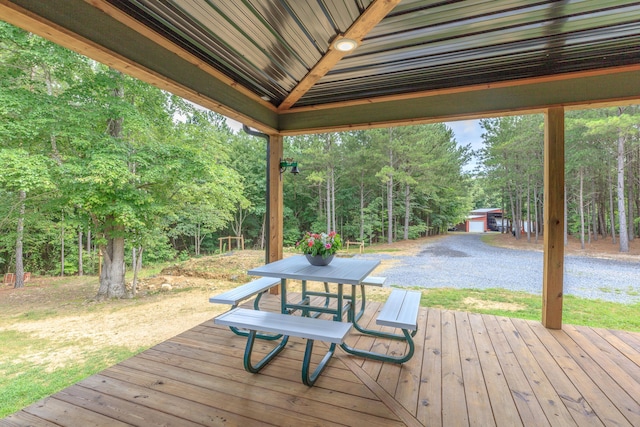 508 Chattanooga Rd, Cohutta, GA 30710 - deck with outdoor dining area, view of scattered trees, and a lawn