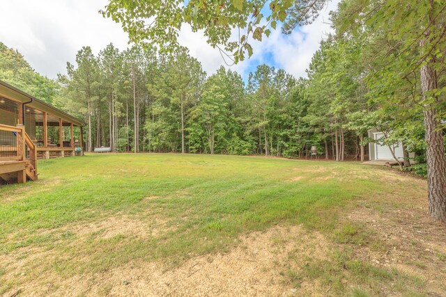 508 Chattanooga Rd, Cohutta, GA 30710 - view of green lawn featuring a storage shed, a garage, and a forest view