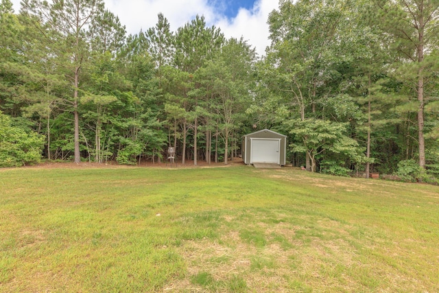 508 Chattanooga Rd, Cohutta, GA 30710 - view of green lawn featuring a garage, a shed, and a view of trees