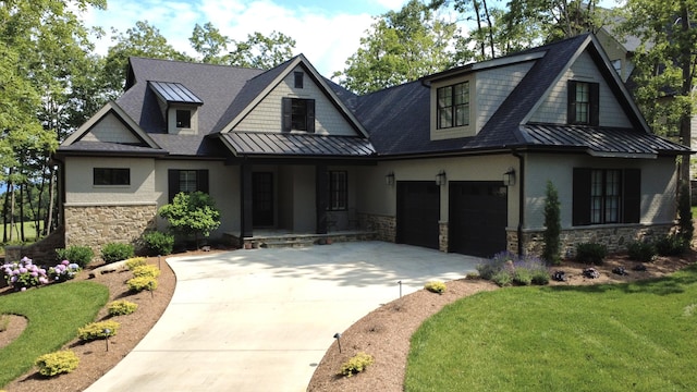 179 Rushing Water Trl, Rising Fawn, GA 30738 - view of front of house with a standing seam roof, stone siding, driveway, covered porch, and a front lawn