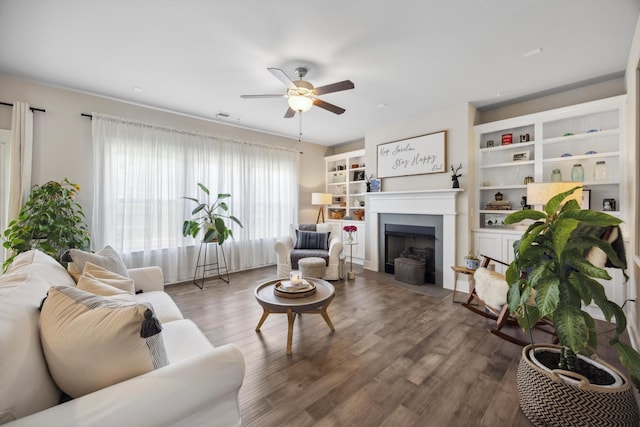 8517 Kensley Ln, Hixson, TN 37343 - living area featuring ceiling fan, wood finished floors, and a fireplace with flush hearth