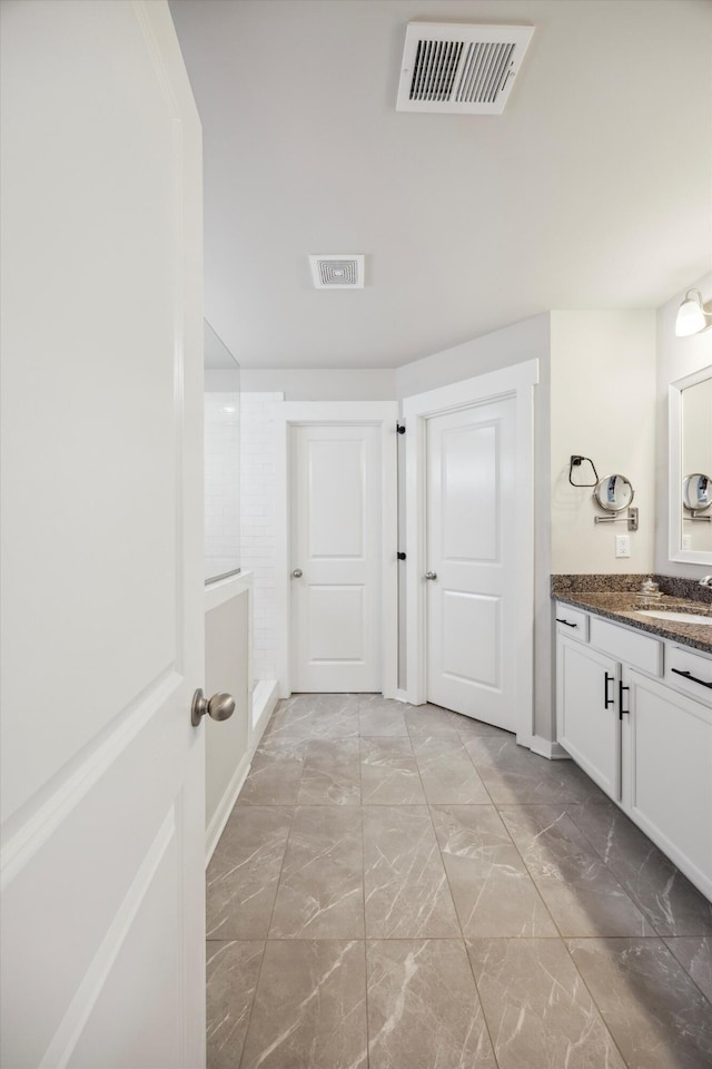 8517 Kensley Ln, Hixson, TN 37343 - full bath featuring vanity and marble look tiles