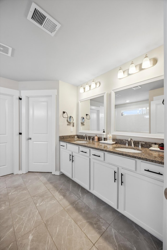 8517 Kensley Ln, Hixson, TN 37343 - full bath featuring double vanity and marble finish flooring