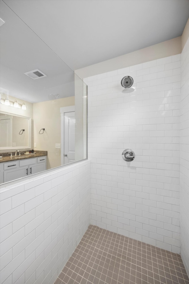 8517 Kensley Ln, Hixson, TN 37343 - full bathroom with a tile shower and vanity