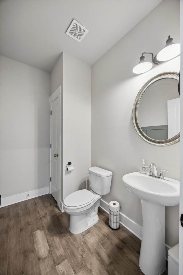 8517 Kensley Ln, Hixson, TN 37343 - bathroom with toilet and wood finished floors