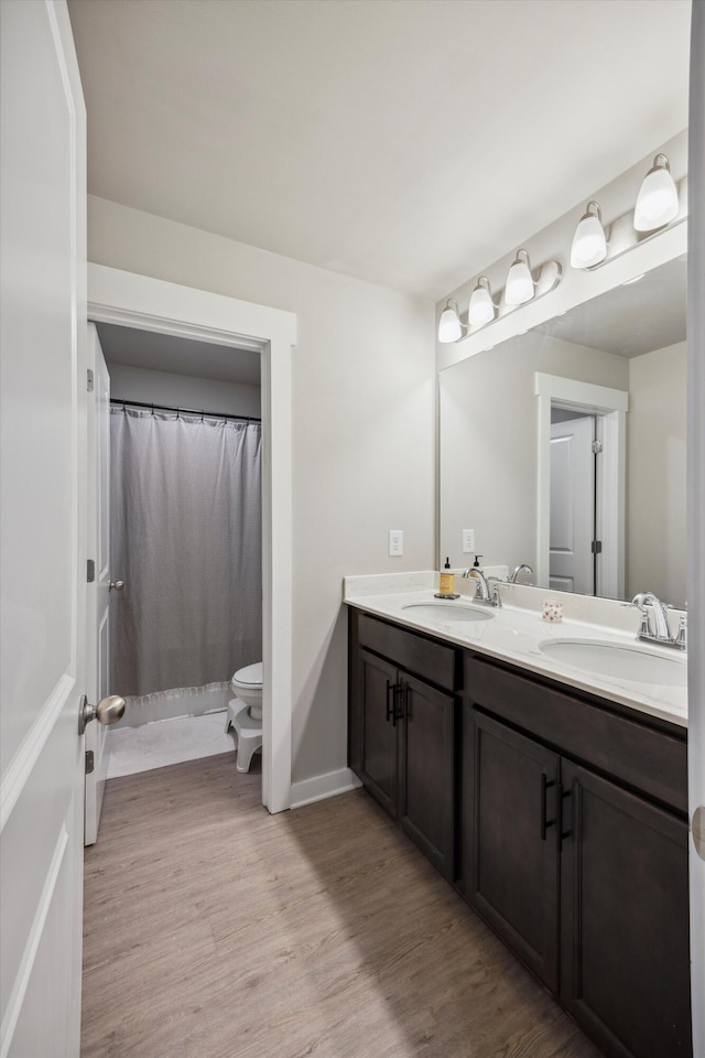 8517 Kensley Ln, Hixson, TN 37343 - bathroom featuring double vanity, wood finished floors, and a shower with curtain
