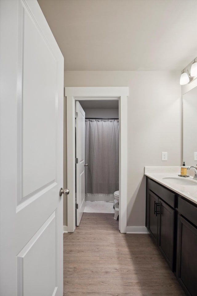 8517 Kensley Ln, Hixson, TN 37343 - bathroom featuring vanity, wood finished floors, and a shower with curtain