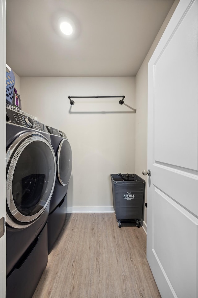 8517 Kensley Ln, Hixson, TN 37343 - laundry room featuring washing machine and clothes dryer and wood finished floors