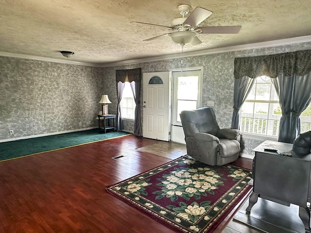 1467 Squire Fox Rd, Dandridge, TN 37725 - living area with ornamental molding, wallpapered walls, wood finished floors, a ceiling fan, and a textured ceiling