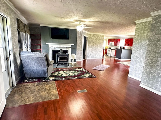 1467 Squire Fox Rd, Dandridge, TN 37725 - living room with a ceiling fan, wood finished floors, a textured ceiling, crown molding, and wallpapered walls