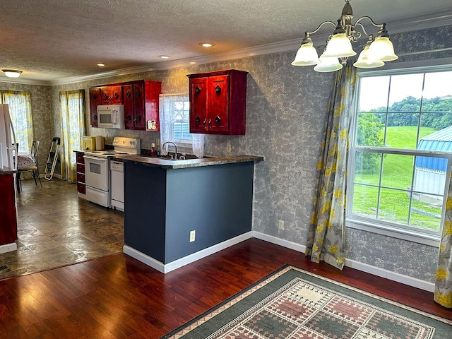 1467 Squire Fox Rd, Dandridge, TN 37725 - kitchen with white appliances, dark brown cabinets, crown molding, a textured ceiling, and a chandelier