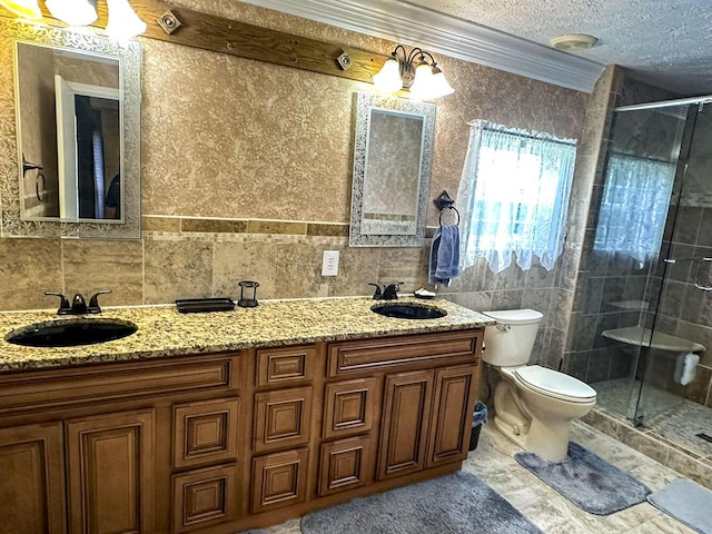 1467 Squire Fox Rd, Dandridge, TN 37725 - full bathroom with a shower stall, double vanity, crown molding, tile walls, and a textured ceiling