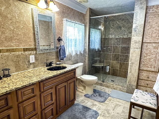 1467 Squire Fox Rd, Dandridge, TN 37725 - bathroom featuring vanity, tile walls, a shower stall, a textured ceiling, and ornamental molding