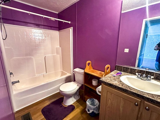 1467 Squire Fox Rd, Dandridge, TN 37725 - full bathroom with a textured ceiling, wood finished floors, bathing tub / shower combination, and vanity