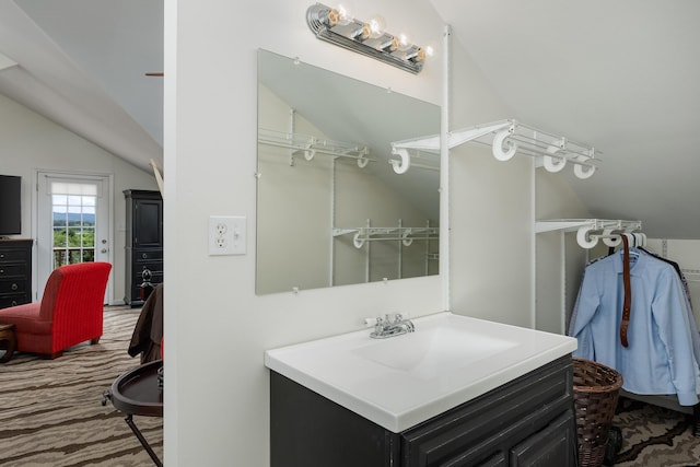 8223 Snow Hill Rd, Ooltewah, TN 37363 - bathroom featuring vaulted ceiling and vanity