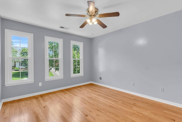 7414 Hamilton Run Dr, Chattanooga, TN 37421 - empty room with healthy amount of natural light, light wood-type flooring, and a ceiling fan