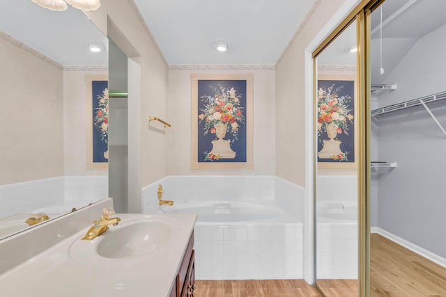 7414 Hamilton Run Dr, Chattanooga, TN 37421 - bathroom featuring wood finished floors, a bath, vanity, and a spacious closet