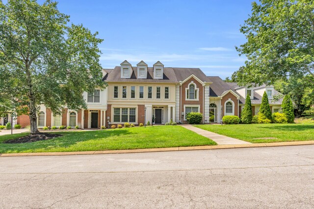 7414 Hamilton Run Dr, Chattanooga, TN 37421 - colonial home with a front lawn and brick siding