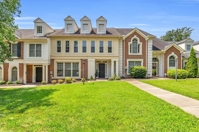 7414 Hamilton Run Dr, Chattanooga, TN 37421 - colonial-style house with brick siding and a front lawn