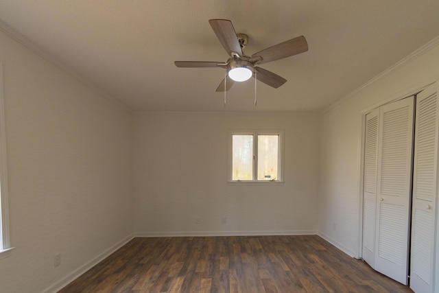 136 Cochran Dr NE, Dalton, GA 30721 - unfurnished bedroom featuring crown molding, dark wood-type flooring, a closet, and a ceiling fan