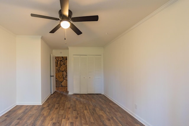 136 Cochran Dr NE, Dalton, GA 30721 - unfurnished bedroom with dark wood-style floors, a closet, ornamental molding, and ceiling fan