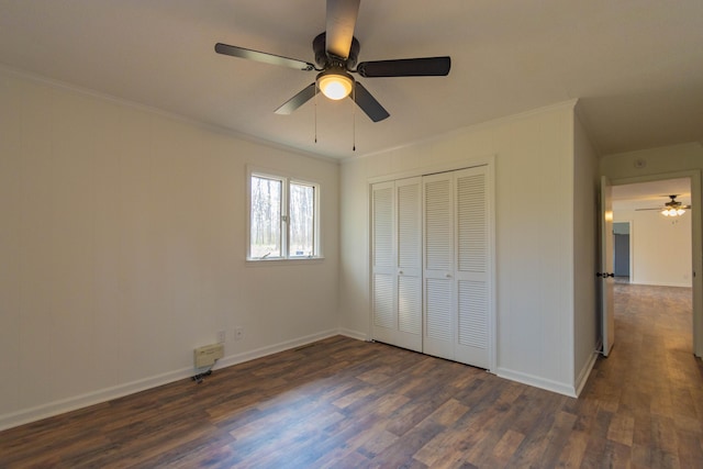 136 Cochran Dr NE, Dalton, GA 30721 - unfurnished bedroom with dark wood finished floors, ornamental molding, a closet, and ceiling fan