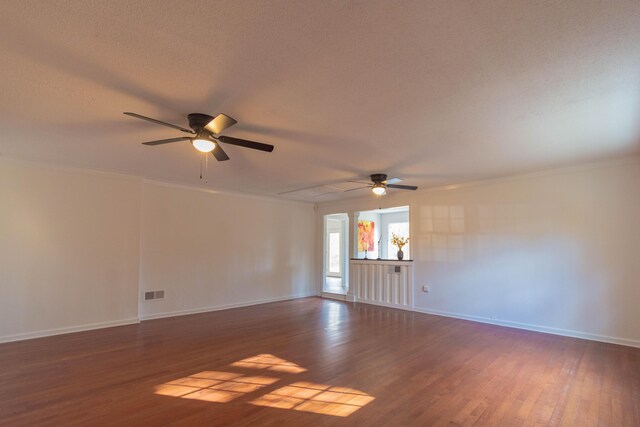 136 Cochran Dr NE, Dalton, GA 30721 - unfurnished room featuring ceiling fan, wood finished floors, attic access, a textured ceiling, and ornamental molding