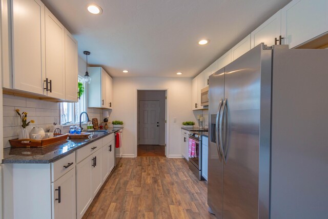 136 Cochran Dr NE, Dalton, GA 30721 - kitchen featuring stainless steel appliances, recessed lighting, white cabinets, and decorative backsplash