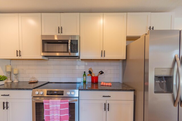 136 Cochran Dr NE, Dalton, GA 30721 - kitchen with appliances with stainless steel finishes and white cabinetry