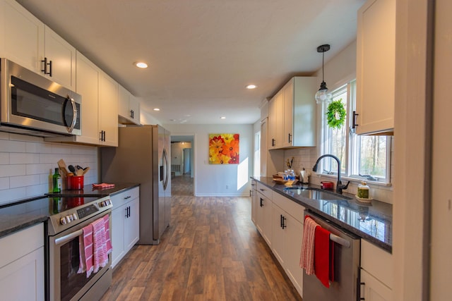 136 Cochran Dr NE, Dalton, GA 30721 - kitchen with stainless steel appliances, dark wood-type flooring, white cabinets, dark stone countertops, and recessed lighting