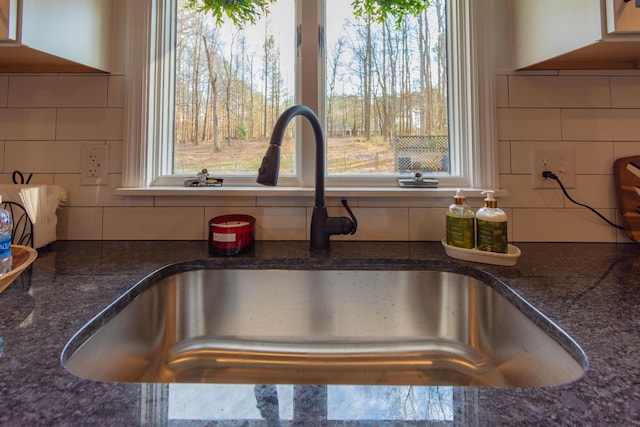 136 Cochran Dr NE, Dalton, GA 30721 - kitchen view of decorative backsplash and dark stone countertops