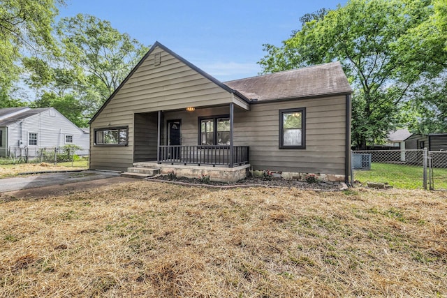 1610 Truman Ave, Chattanooga, TN 37412 - view of front of property with covered porch, a gate, and roof with shingles