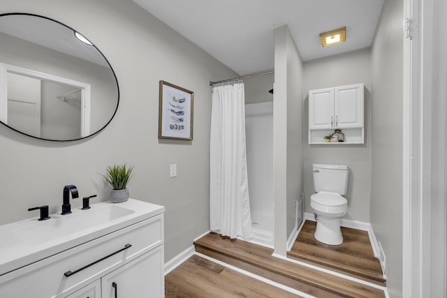 1610 Truman Ave, Chattanooga, TN 37412 - bathroom featuring vanity, wood finished floors, and a shower with shower curtain