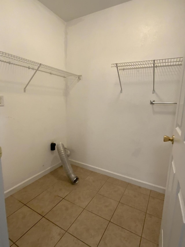 904 Cedar Creek Dr, Rossville, GA 30741 - laundry room featuring light tile patterned flooring and baseboards