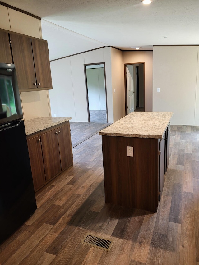 1918 Spradling Rd, Soddy Daisy, TN 37379 - kitchen with freestanding refrigerator, light countertops, dark wood-type flooring, dark brown cabinetry, and recessed lighting