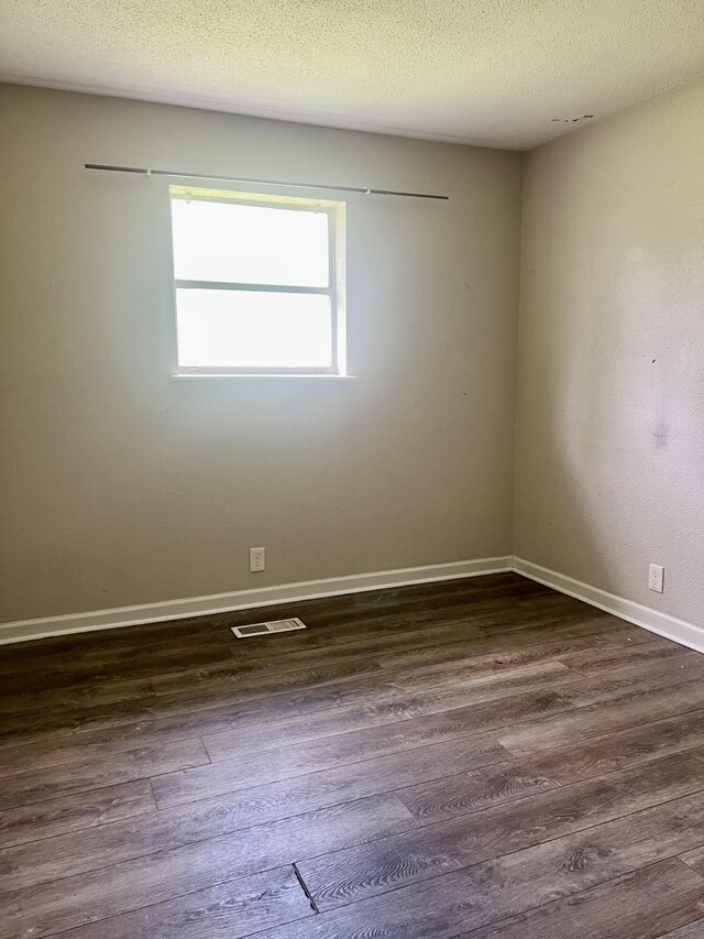 43 Fir St, Chickamauga, GA 30707 - empty room with dark wood finished floors and baseboards