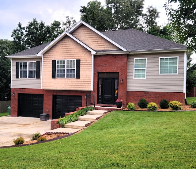 458 Fieldstone Dr, Ringgold, GA 30736 - split foyer home with an attached garage, brick siding, driveway, and a front lawn