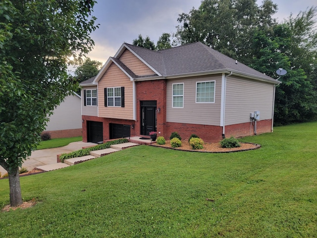458 Fieldstone Dr, Ringgold, GA 30736 - split foyer home with an attached garage, a lawn, brick siding, and concrete driveway